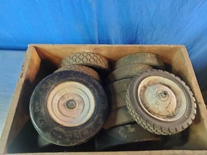 Several solid rubber replacement wheels, commonly used for utility equipment.