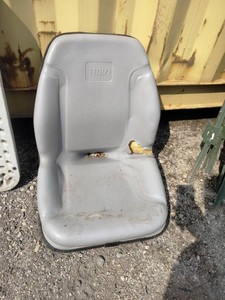 High-back vinyl operator seat branded with the Toro logo