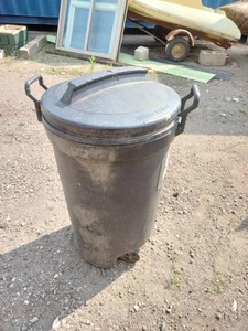 Heavy-duty, black plastic rolling outdoor trash can