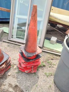Stack of red-orange traffic safety cones