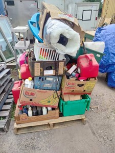 Pallet loaded with a jumble of miscellaneous items
