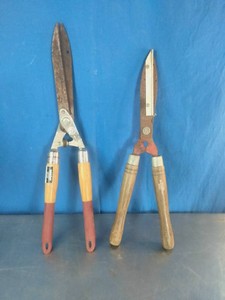 Two traditional manual garden hedge shears