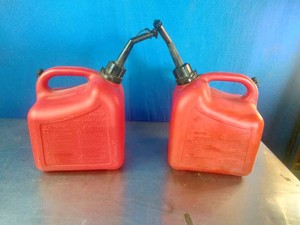 Two matching gas cans , 1 gallon