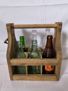 6 Vintage glass bottles with wood carrier