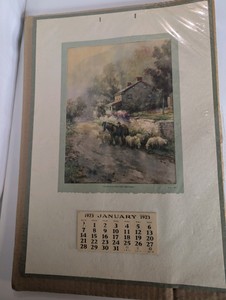 Vintage 1923 advertising wall calendar featuring an art print titled HomeOur Greatest Heritage with a rural cottage, farmer, horses