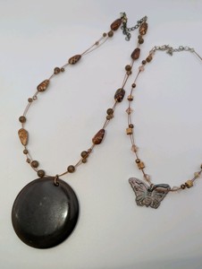 Iridescent abalone shell and wood bead butterfly necklace and brown cats-eye glass disc statement necklace