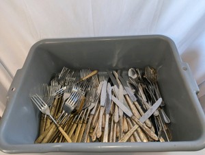 Tub full of vintage flatware