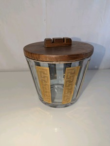 Vintage mid-century modern glass ice bucket featuring a 22k gold Greek key pattern and a wooden lid
