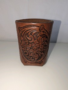 Vintage hand-tooled leather desk cup, intricate floral and scrollwork design