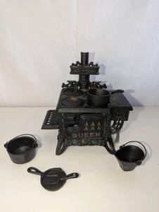 Vintage Queen miniature cast iron stove with cast iron accessories