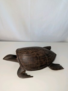 Hand-carved ironwood sea turtle figurine with a polished dark grain