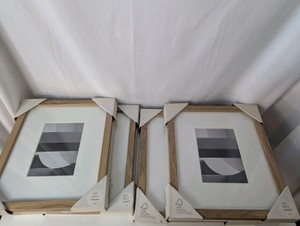 New (4) light wood-finish gallery picture frames with white mats 10x12 matted to 5x7