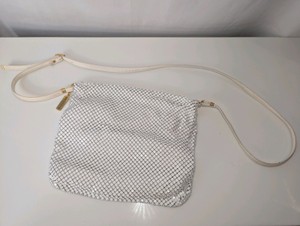 Vintage Whiting & Davis white metal mesh shoulder bag with an adjustable strap and gold-tone hardware
