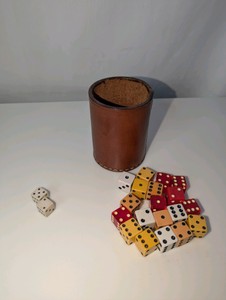 Vintage leather dice cup and vintage dice collection
