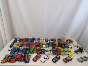 Collection of loose die-cast toy vehicles- Hot Wheels, Matchbox, and Nintendo Mario Kart figures