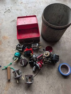 Vintage Fishing Reel Assortment in Metal Tackle Box