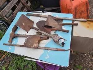 Old Rusty Garden Tools Including Shovels, Garden Hoe, and Weeding Tool