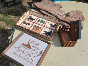 Rustic Home Decor Including Wooden Wall Sign, Woven Tray, and Barn-Shaped Wall Art