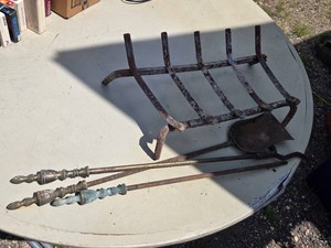 Iron fireplace grate and tools including two pokers and a small shovel