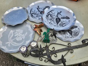 Assorted Decorative Items Including Aluminum Plates, Vintage Prang Powder, and Metal Wall Sconce