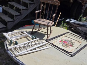 Rustic Wooden Rocking Chair, Decorative Tray, and Disassembled Doll Crib Frame with Wheels