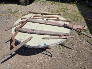 Lot of antique farm equipment including yokes and hames