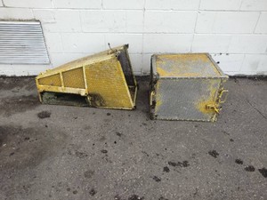 Commercial grass catcher baggers, likely from brands like Lesco, Wright, or Packem.