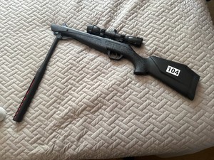 Break action air rifle with scope