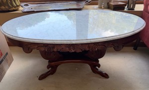 Carved Solid Wood Oval Coffee Table with Genuine White Marble Top  Approx. 48W x 29D x 18H - Some Markings are visable on table.
