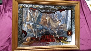 Vintage Old Milwakee sign with a deer scenery