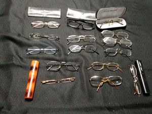 Lot of reading glasses and cases