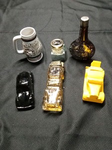 Avon collectible decanters, mug and cream sachet