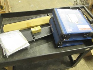 Under desk sliding keyboard tray and 4 large binders