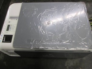 HP Photosmart C4210 all in one printer, new, out of box no power cord