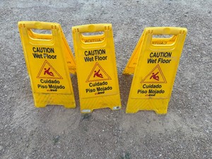 Three Plastic Caution Wet Floor Signs