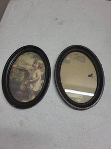 Pair of Vintage Oval Black Wall Frames One With Child Print Art
