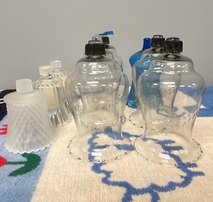 collection of vintage glass peg votive candle holders and hurricane shades
