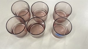 pink lowball or juice glasses with a heavy flat base.