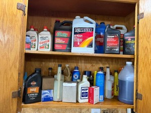 2 Shelves of Auto Supplies - Oil, Brake Fluid, Belt Dressing