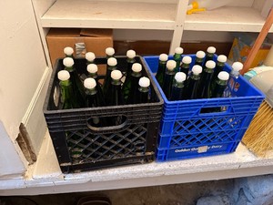 2 Dairy Totes of Green Glass Wine Bottles with Caps (24 total)