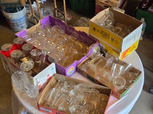Multiple boxes of assorted drinking glasses