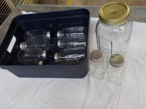 11 Clear Glass Jars in a plastic To...