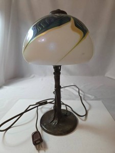 Vintage Cast Iron Excelsior Lamp  with a stylized bronze base.  Lamp is 14 high and features a glass pulled feather lamp shade and tree truck base. Very collectible.  Lamp is very heavy and works. Circa. (1910s-1930s).