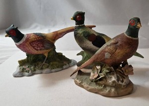 Three - VINTAGE- Ceramic Ring Necked Pheasant figurines VERY COLLECTIBLE.&nbsp Largest pheasant is 8 long by 4 tall.
