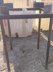 TALL STEEL FRAME USED FOR BULK FLUID CONTAINERS