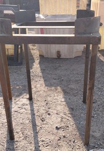 TALL STEEL FRAME USED FOR HOLDING BULK LIQUID CONTAINERS