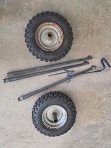 2 SMALLER CARLISLE TIRES AND MISC METAL PIPES