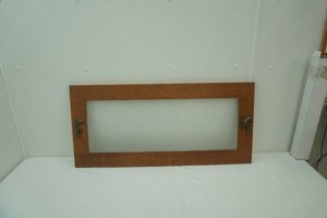 mission style oak wall window with coat hooks