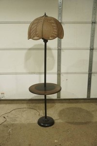 vintage floor lamp. built in side table and woven shade