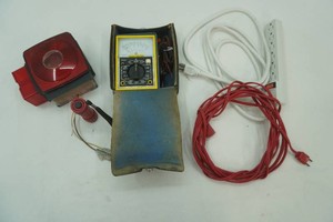 multi meter tester, extension cord, multi outlet strip, tail lamp